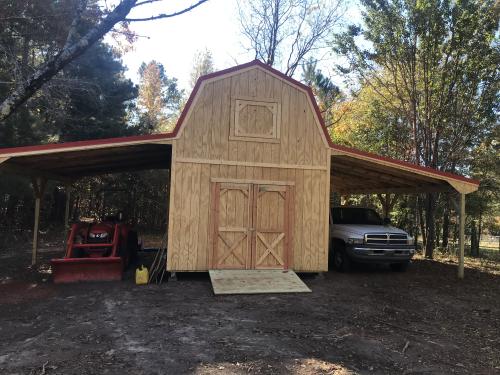 16X24 Barn style with 8' sidewalls, two lean-tos, ramp, and a metal roof.
